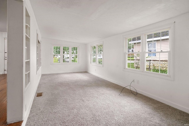 2305 N Armstrong St, Kokomo, IN 46901 - unfurnished room featuring vaulted ceiling and carpet flooring