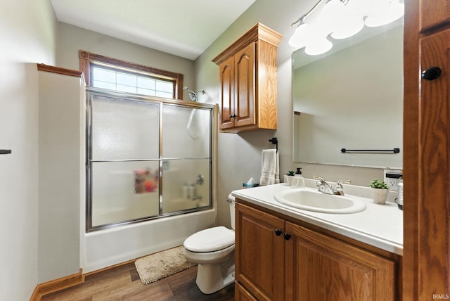 5595 N State Road 109, Columbia City, IN 46825 - full bath with vanity, bath / shower combo with glass door, and wood finished floors