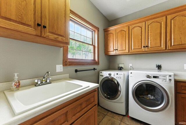 5595 N State Road 109, Columbia City, IN 46825 - laundry room featuring cabinet space, washer and clothes dryer, and light tile patterned floors