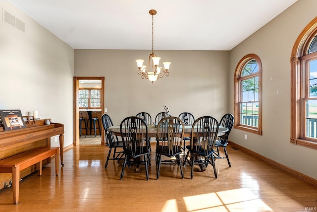 5595 N State Road 109, Columbia City, IN 46825 - dining room featuring a chandelier, healthy amount of natural light, and light wood-type flooring