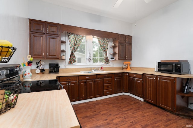102 E Peterson St, Otterbein, IN 47970 - kitchen with open shelves, black appliances, dark wood-style flooring, and ceiling fan