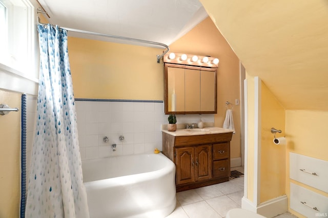 102 E Peterson St, Otterbein, IN 47970 - full bathroom featuring a tub to relax in, tile patterned floors, vanity, curtained shower, and lofted ceiling