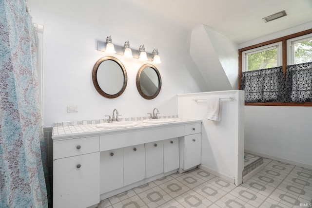 102 E Peterson St, Otterbein, IN 47970 - bathroom with double vanity and tile patterned floors