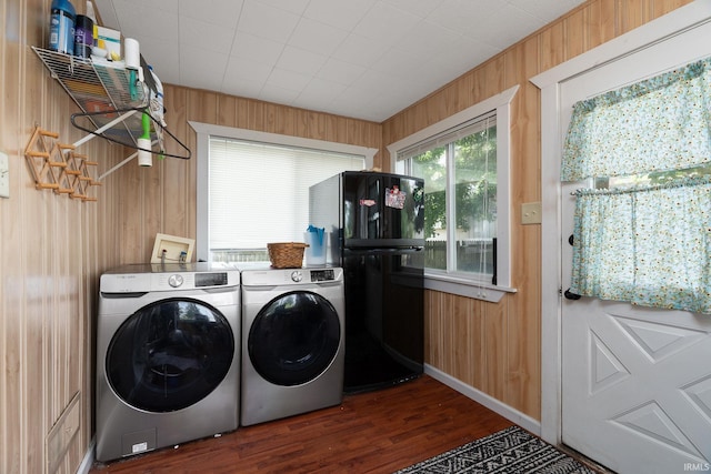 102 E Peterson St, Otterbein, IN 47970 - laundry room with washing machine and clothes dryer, wooden walls, and dark wood-style floors