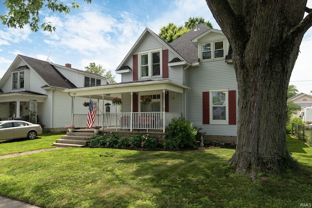 102 E Peterson St, Otterbein, IN 47970 - view of front of house with a porch and a front lawn
