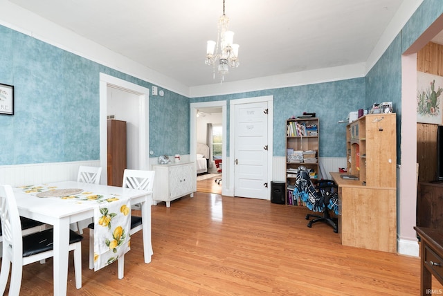 102 E Peterson St, Otterbein, IN 47970 - dining space with a chandelier, light wood-type flooring, and wallpapered walls