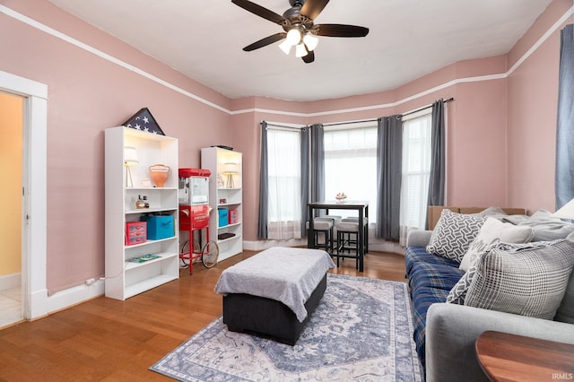 102 E Peterson St, Otterbein, IN 47970 - living area with ceiling fan and wood finished floors