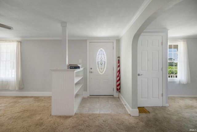 7404 N State Road 13, North Webster, IN 46555 - entrance foyer featuring carpet floors, ornamental molding, and arched walkways