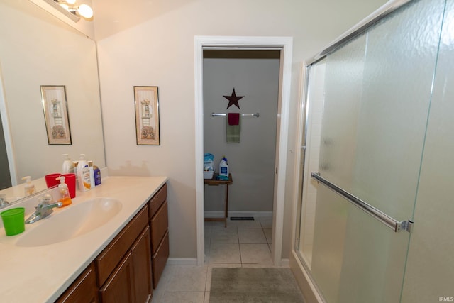 920 Cary Ct, South Bend, IN 46614 - bathroom with tile patterned flooring, vanity, and a shower stall