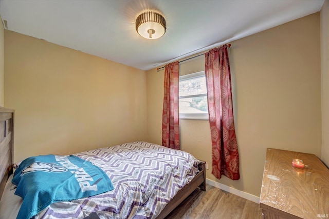 3121 S Yonkers St, Bloomington, IN 47403 - bedroom featuring wood finished floors and baseboards