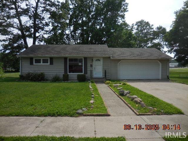 1608 Sunset Dr, Rochester, IN 46975 - view of front of property with a garage, a front yard, and driveway