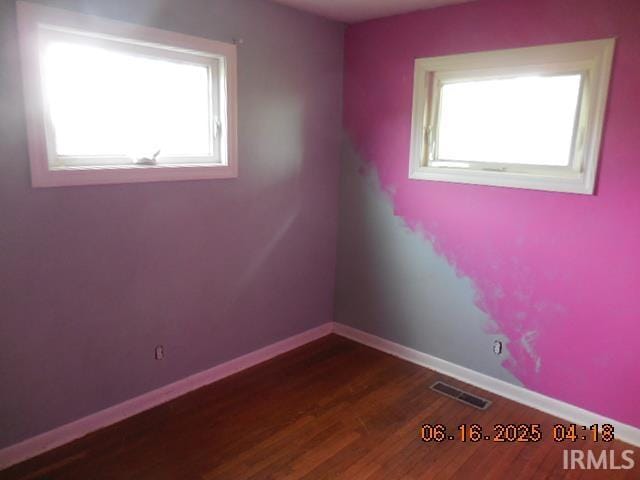 1608 Sunset Dr, Rochester, IN 46975 - spare room featuring dark wood-style flooring and baseboards
