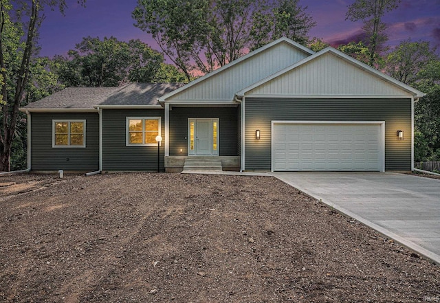 54207 Starner Ave, Elkhart, IN 46514 - view of front of home with driveway and an attached garage