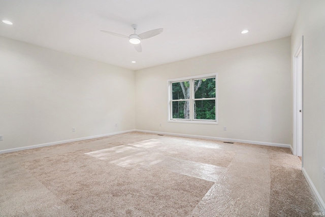 54207 Starner Ave, Elkhart, IN 46514 - spare room featuring light carpet, a ceiling fan, and recessed lighting