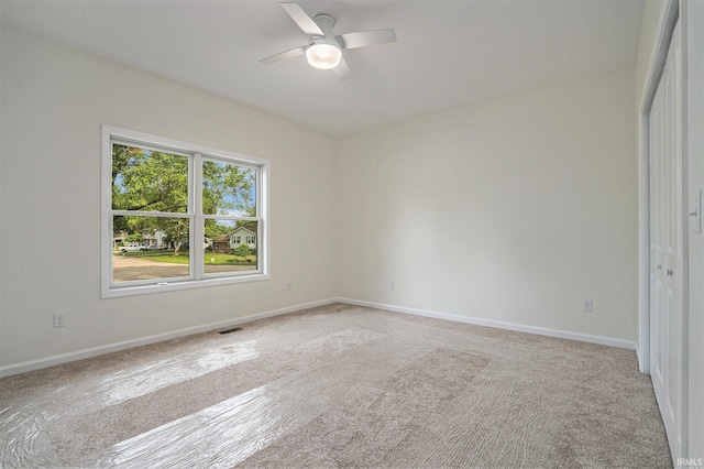54207 Starner Ave, Elkhart, IN 46514 - unfurnished bedroom with light colored carpet, a closet, and ceiling fan