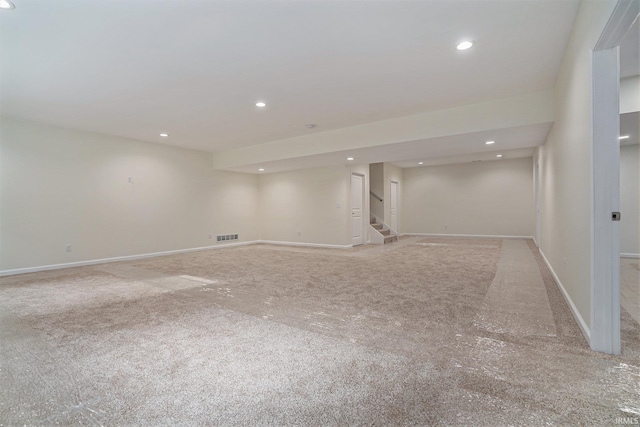 54207 Starner Ave, Elkhart, IN 46514 - finished basement featuring light carpet, stairway, and recessed lighting