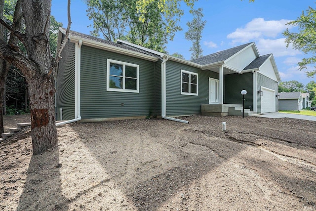 54207 Starner Ave, Elkhart, IN 46514 - ranch-style home with a garage, concrete driveway, and roof with shingles