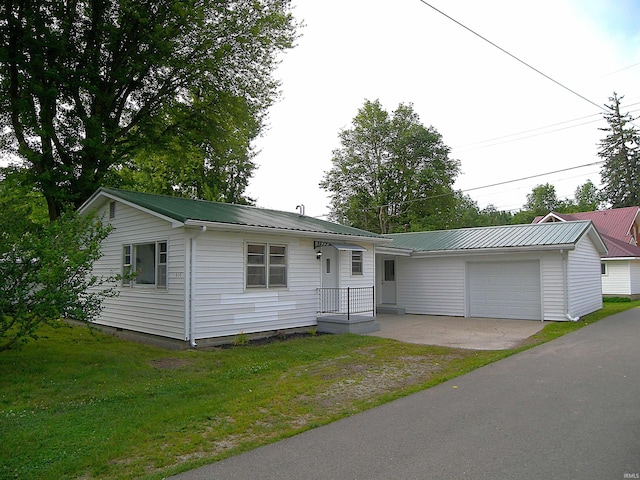 607 E Walnut St, Akron, IN 46910 - ranch-style home with a metal roof, a front lawn, an attached garage, driveway, and crawl space