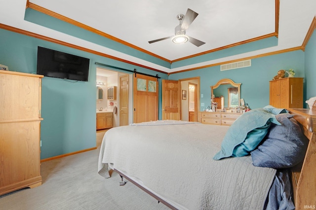 1321 Lost Lock Way, New Haven, IN 46774 - bedroom with crown molding, a tray ceiling, light carpet, ensuite bath, and ceiling fan