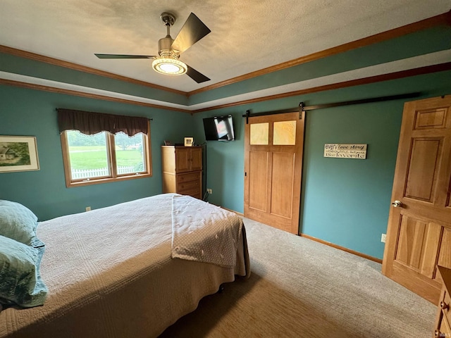 1321 Lost Lock Way, New Haven, IN 46774 - carpeted bedroom featuring a barn door, a raised ceiling, ornamental molding, and ceiling fan