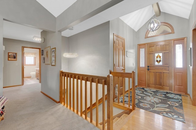 1321 Lost Lock Way, New Haven, IN 46774 - entryway with beam ceiling, a chandelier, wood finished floors, and high vaulted ceiling