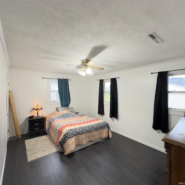 125 Ruby Rd, Attica, IN 47918 - bedroom featuring dark wood-style floors, a textured ceiling, and a ceiling fan