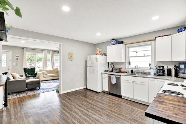 26 E Plum St, Anderson, IN 46012 - kitchen featuring white appliances, plenty of natural light, wood finished floors, recessed lighting, and open floor plan