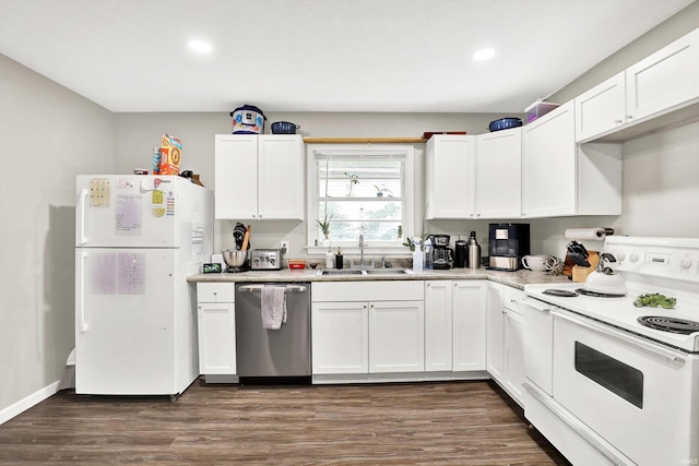 26 E Plum St, Anderson, IN 46012 - kitchen with white appliances, recessed lighting, white cabinets, and dark wood-style floors