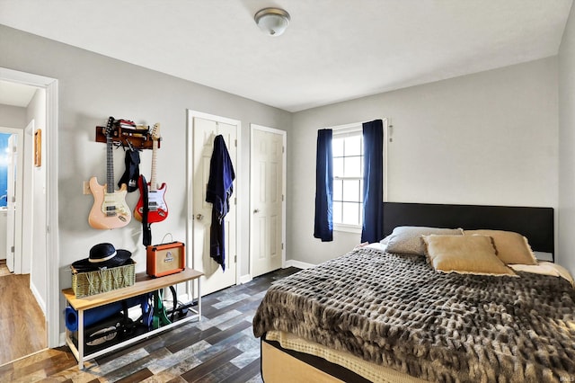 26 E Plum St, Anderson, IN 46012 - bedroom with dark wood finished floors and baseboards