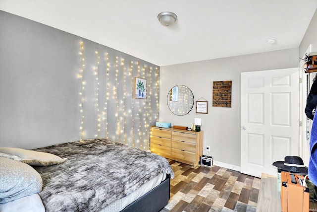 26 E Plum St, Anderson, IN 46012 - bedroom featuring dark wood-style floors and baseboards