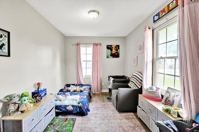 26 E Plum St, Anderson, IN 46012 - bedroom featuring light wood-style floors and baseboards
