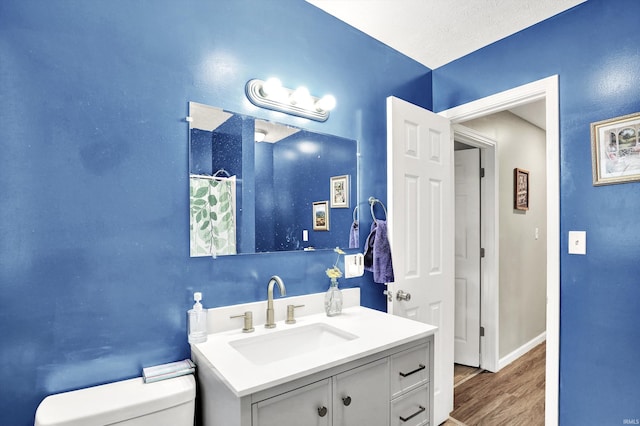 26 E Plum St, Anderson, IN 46012 - bathroom featuring vanity and wood finished floors
