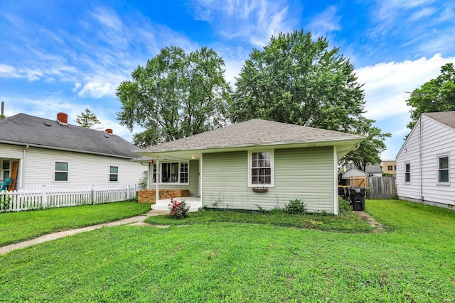 26 E Plum St, Anderson, IN 46012 - back of house with a fenced backyard and roof with shingles
