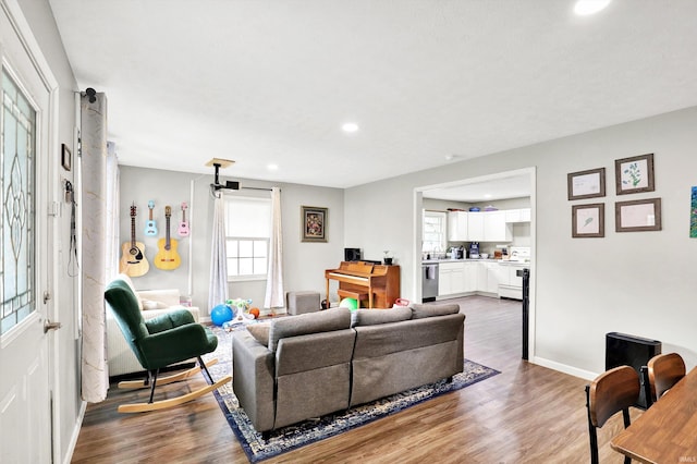 26 E Plum St, Anderson, IN 46012 - living area featuring healthy amount of natural light, wood finished floors, and recessed lighting