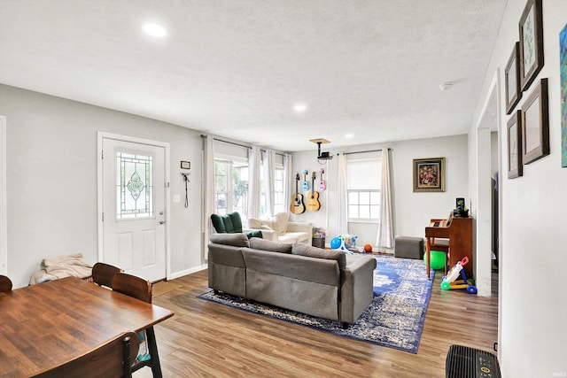 26 E Plum St, Anderson, IN 46012 - living room with wood finished floors, recessed lighting, and a textured ceiling