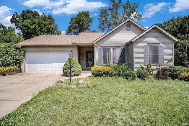 2207 Oakwood Park Dr, South Bend, IN 46628 - single story home with an attached garage, concrete driveway, a front lawn, and a shingled roof