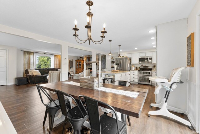 6830 County Road 40, Butler, IN 46721 - dining room with wood finished floors, a chandelier, and recessed lighting