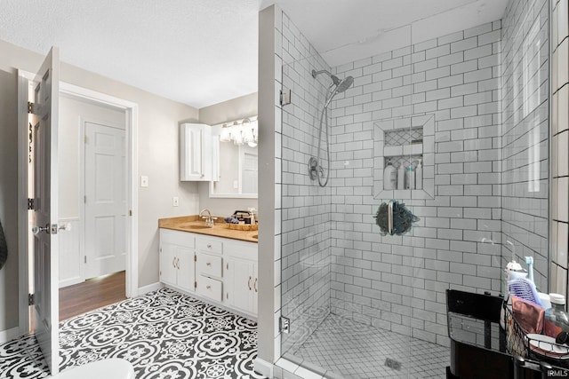 6830 County Road 40, Butler, IN 46721 - full bathroom featuring a shower stall, vanity, and tile patterned flooring
