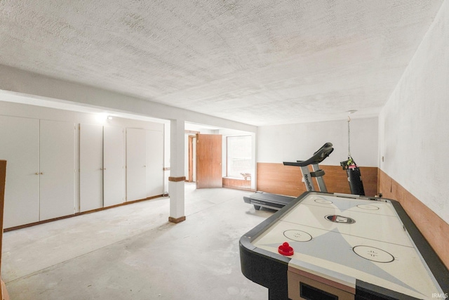 6830 County Road 40, Butler, IN 46721 - recreation room featuring concrete floors and a textured ceiling