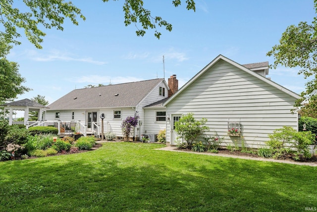 6830 County Road 40, Butler, IN 46721 - rear view of property featuring a yard, a wooden deck, a gazebo, and a shingled roof