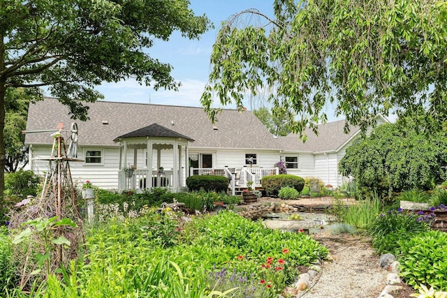 6830 County Road 40, Butler, IN 46721 - back of house featuring a wooden deck and roof with shingles