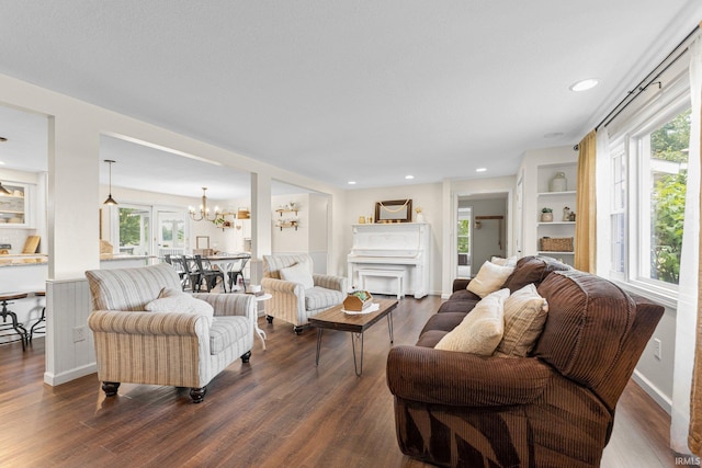 6830 County Road 40, Butler, IN 46721 - living area with a chandelier, dark wood-style floors, plenty of natural light, and recessed lighting