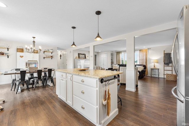 6830 County Road 40, Butler, IN 46721 - kitchen featuring a center island, white cabinetry, dark wood finished floors, and freestanding refrigerator