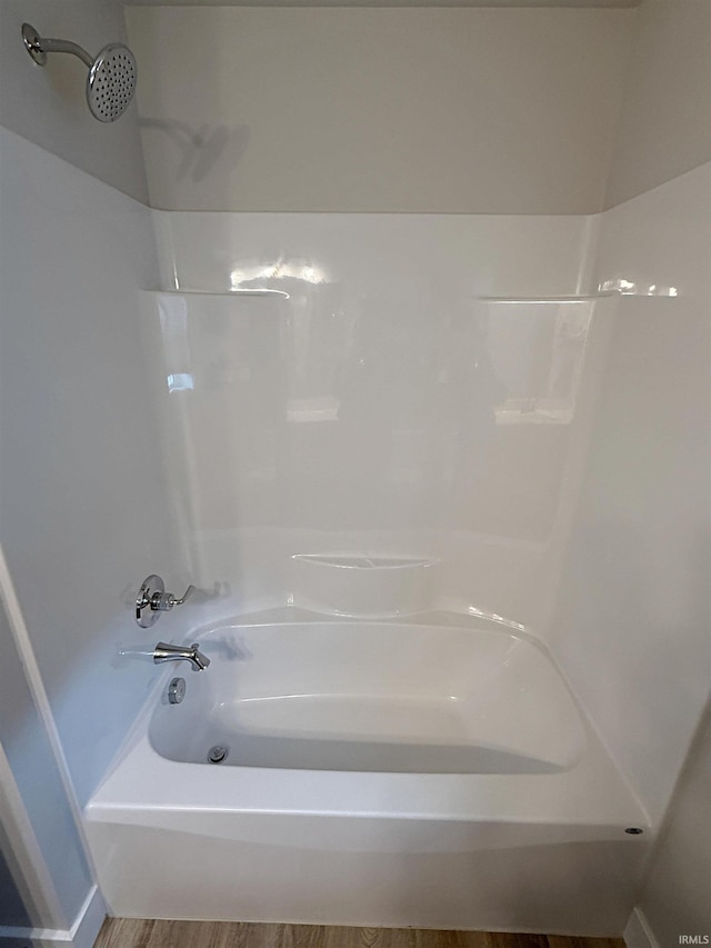 9 Beacon Way, Washington, IN 47501 - bathroom featuring shower / tub combination and wood finished floors