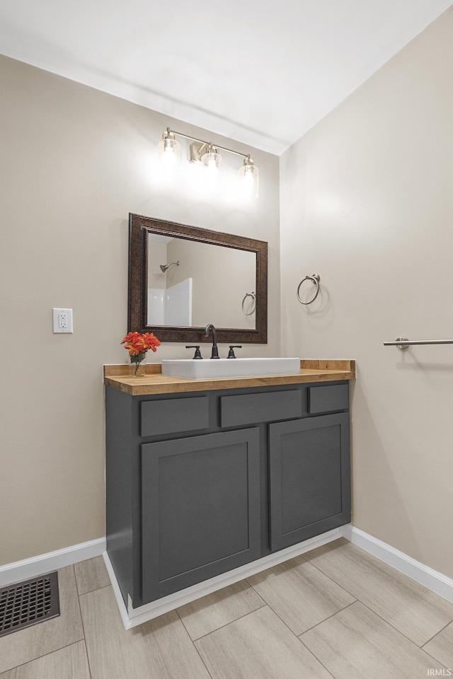 307 W Flora St, Washington, IN 47501 - bathroom with vanity and baseboards