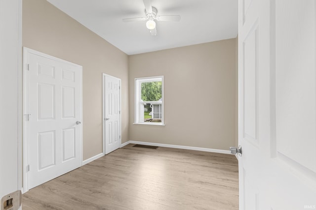 307 W Flora St, Washington, IN 47501 - unfurnished bedroom featuring light wood-type flooring and ceiling fan