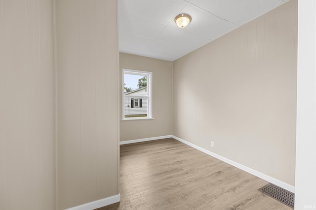 307 W Flora St, Washington, IN 47501 - empty room with wood finished floors and baseboards