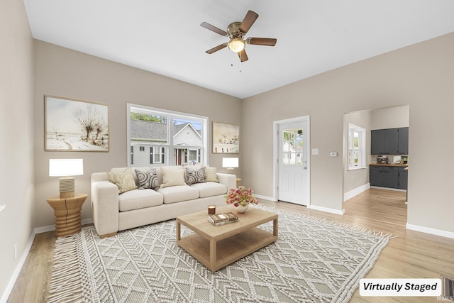 307 W Flora St, Washington, IN 47501 - living area featuring light wood-type flooring and ceiling fan
