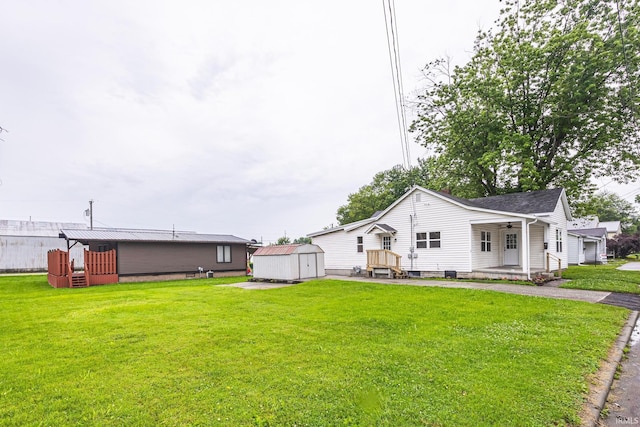 307 W Flora St, Washington, IN 47501 - view of grassy yard with a storage shed and ceiling fan