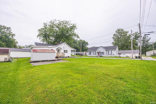 307 W Flora St, Washington, IN 47501 - view of grassy yard with an outdoor structure